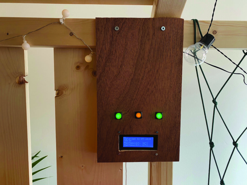 The control box uses a simple LCD display for weather and time