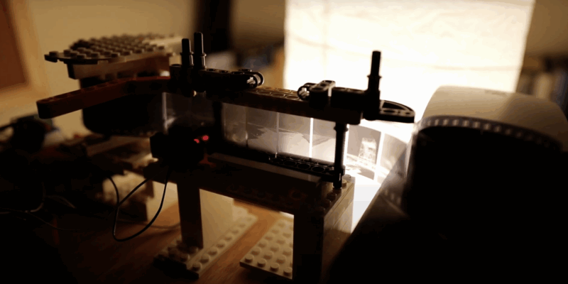 A view of camera film roll turning through the LEGO setup