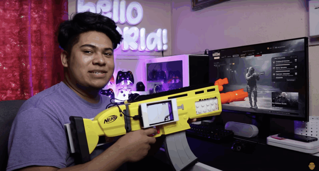 maker holding nerf gun