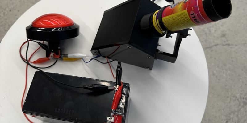 The main device includes a 3D-printed enclosure with the motor, motor driver and Raspberry Pi wired togethe