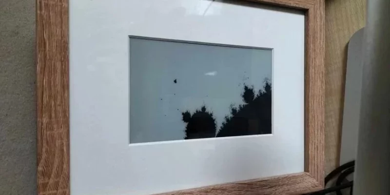 raspberry pi fractal art frame stood on a wooden desk