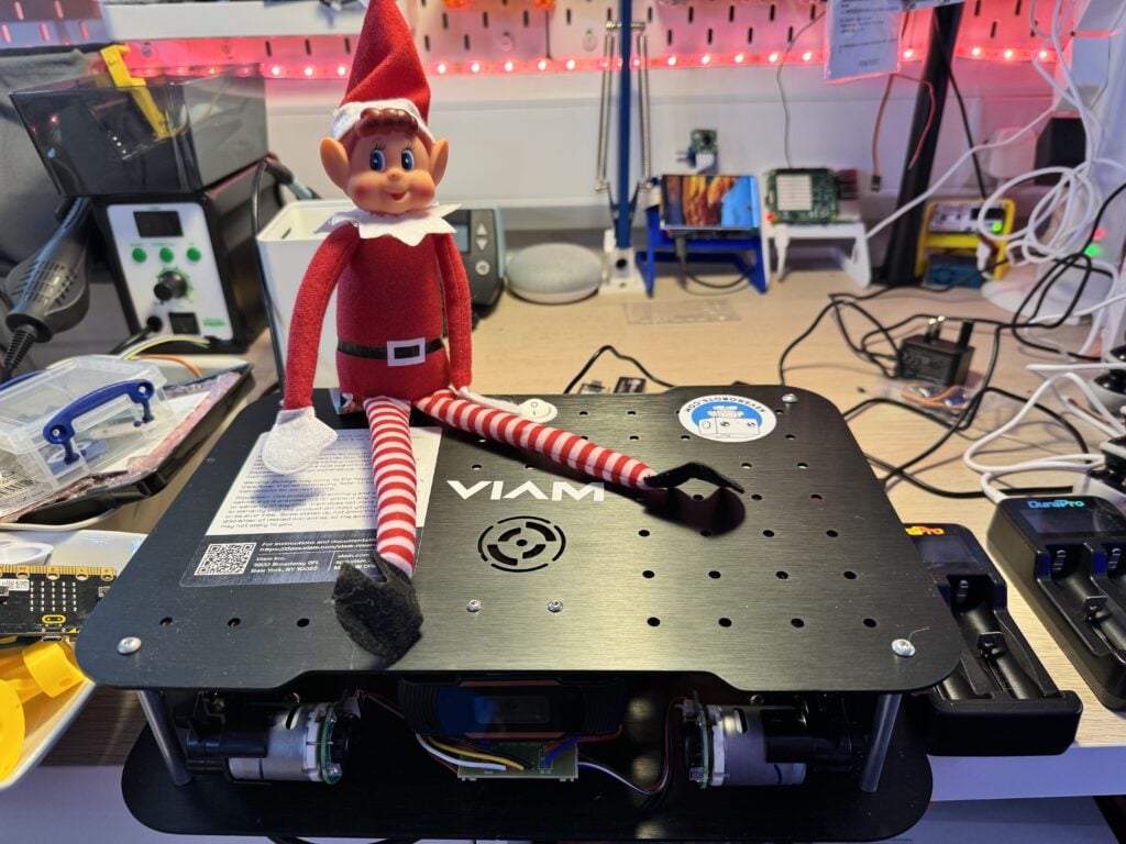 elf sitting on a VIAM black box on kev's messy desk