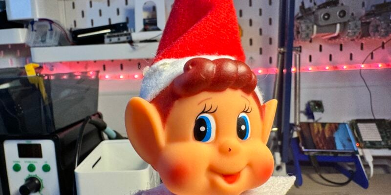 creepy close up of elf face staring sideways at the camera