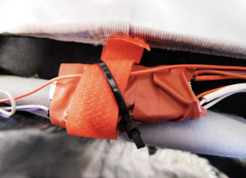 A pico very roughly taped to protect it from the elements and then cable tied to a backpack