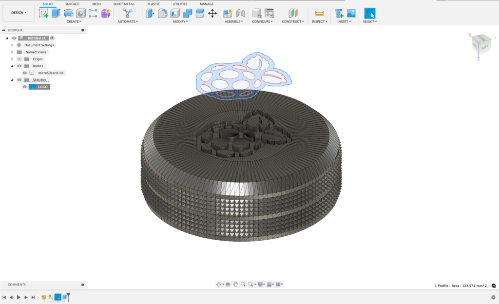 3d render of an sd card holder in a circular shape with a raspberry pi logo embossed on the lid