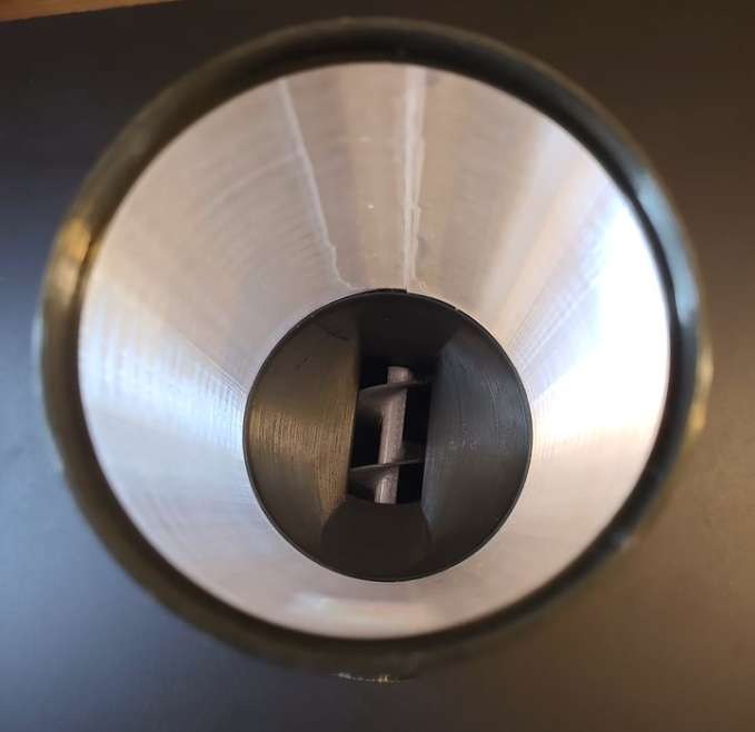 a look down the barrell of the bit which holds the dog biscuits and has a big screw at the end which churns the food into the bowl