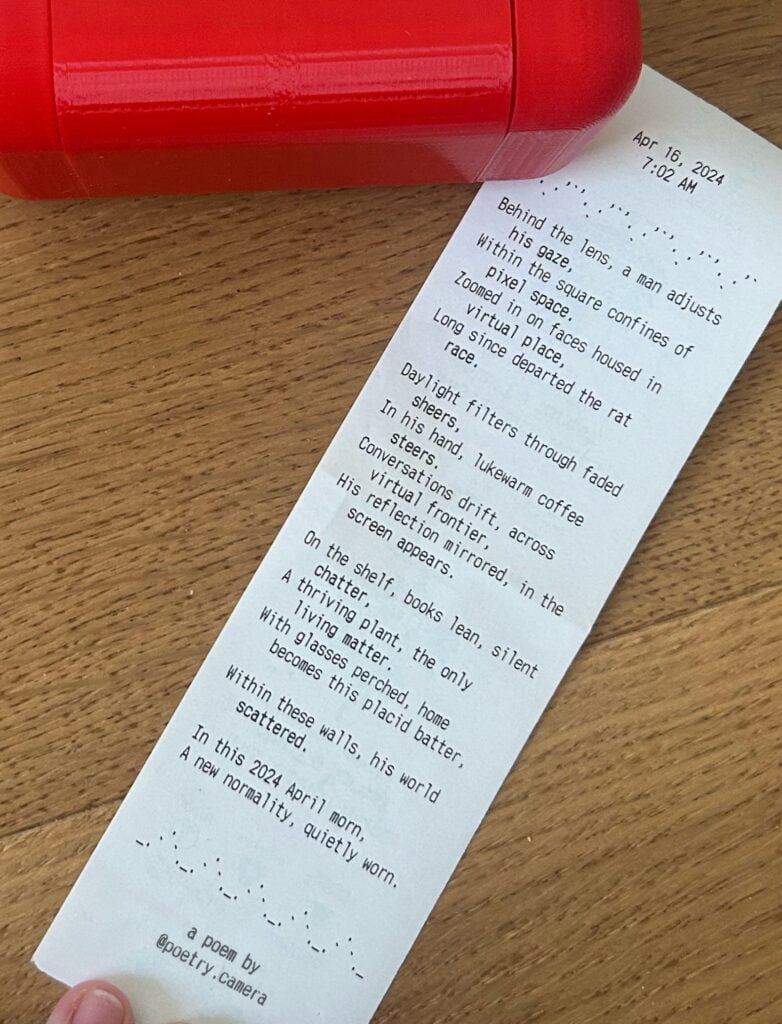 poetry camera "receipt" with a long poem written on it about the view of three people on a zoom call