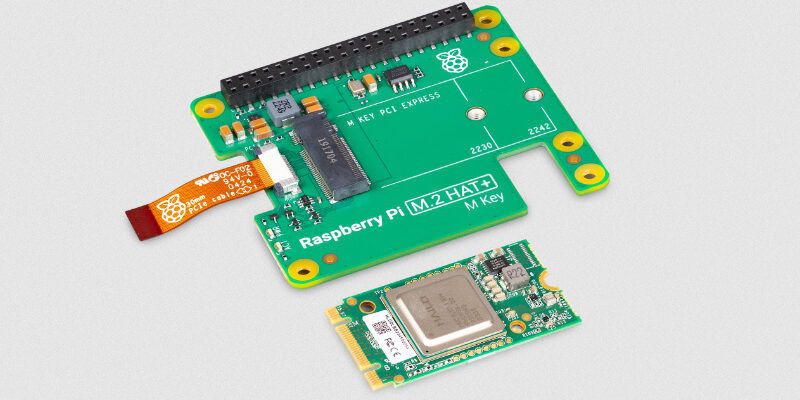 The image shows two components commonly used in conjunction with Raspberry Pi devices. The larger component on the top is a Raspberry Pi M.2 HAT+ (Hardware Attached on Top) board. It features an M.2 connector for PCI Express devices and has mounting holes labeled for different M.2 sizes (2230 and 2242). There is also a ribbon cable connector and other electronic components on the board. The smaller component at the bottom is an M.2 module, likely an NVMe SSD or a different type of PCIe device. It has a metallic shield over the main chip and a gold connector edge designed to fit into the M.2 slot on the HAT+ board. The component also shows a few smaller electronic components and traces on its PCB (Printed Circuit Board). These components are used together to expand the functionality of a Raspberry Pi by adding high-speed storage or other peripherals through the M.2 interface.