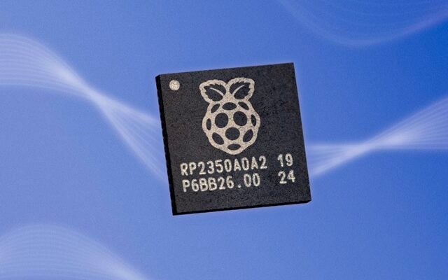 The image shows two RP2350 microcontrollers. The chip on the left features the Raspberry Pi logo, a stylised raspberry with a leaf. The chip is on a stylised sky blue background with what look like thin white cloud wisps darted through it.