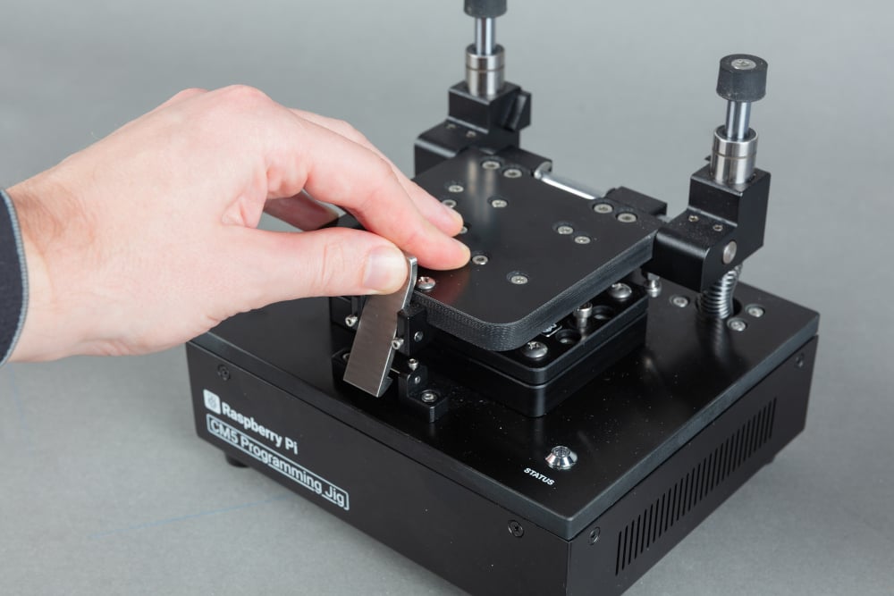 The metal latch on the front of the clamping mechanism holds it shut.
