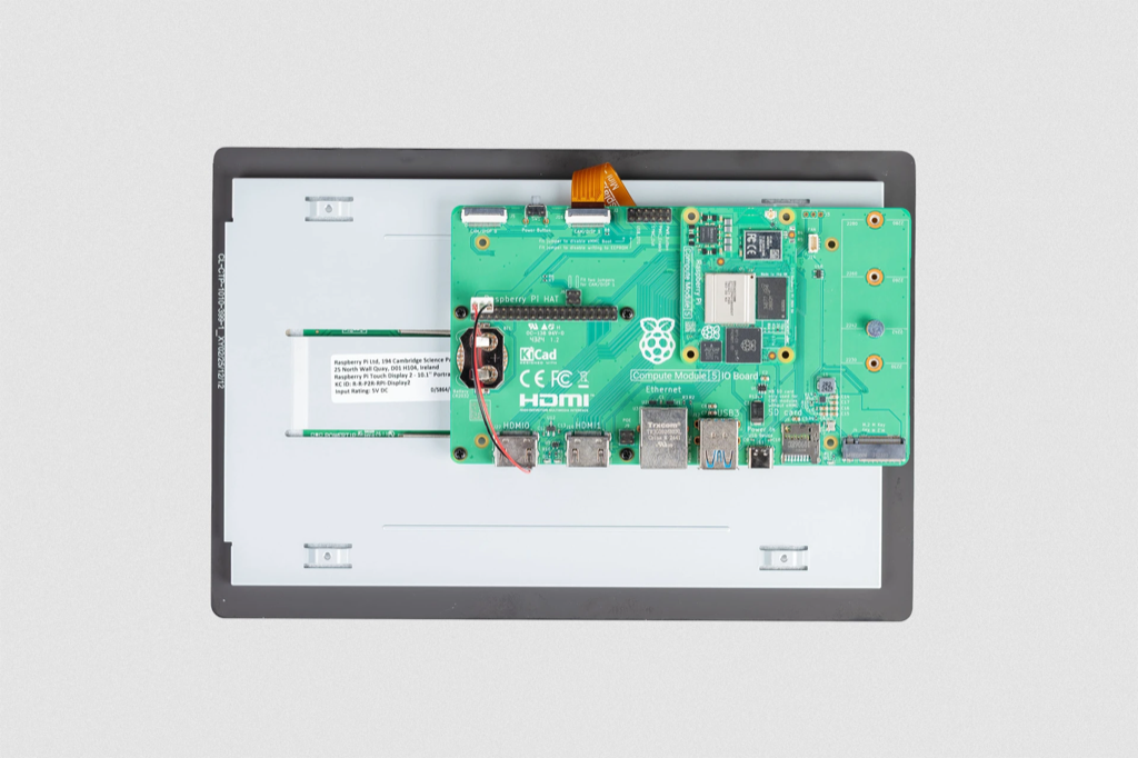 Image showing a Raspberry Pi Compute Module IO Board physically mounted and attached to a Touch Display 2 10-inch model.