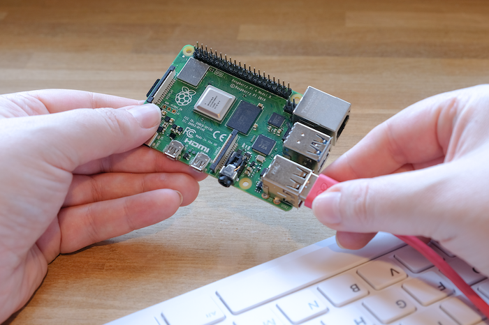 Plugging a keyboard into a Raspberry Pi.